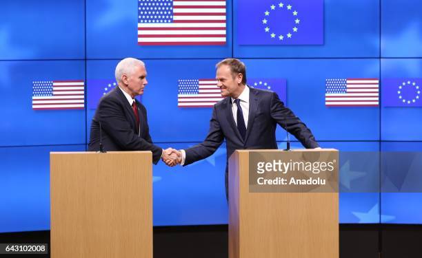 United States Vice President Mike Pence and EU Council President Donald Tusk shake their hands during a joint press conference following their...