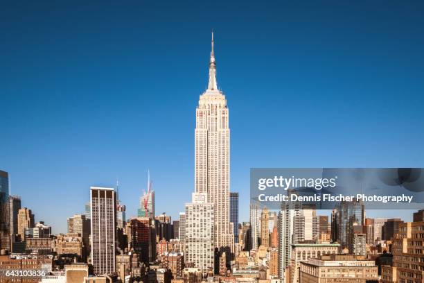 midtown manhattan - empire state building stock-fotos und bilder