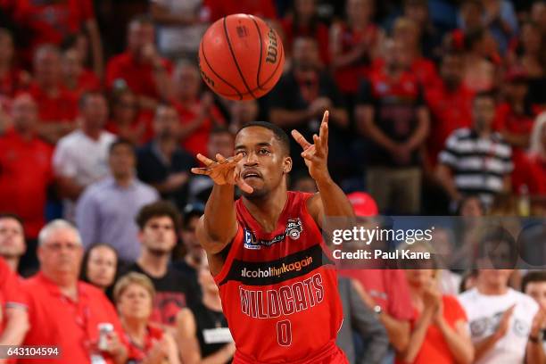 Bryce Cotton of the Wildcats passes the ball during the game two NBL Semi Final match between the Perth Wildcats and Cairns Taipans at Perth Arena on...