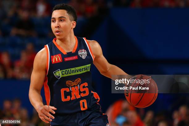 Travis Trice of the Taipans brings the ball up the court during the game two NBL Semi Final match between the Perth Wildcats and Cairns Taipans at...