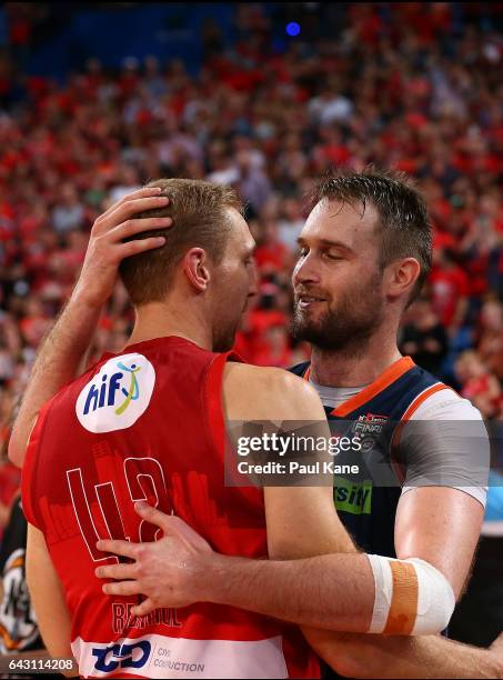 Mark Worthington of the Taipans and Shawn Redhage of the Wildcats embrace after playing his final game during the game two NBL Semi Final match...