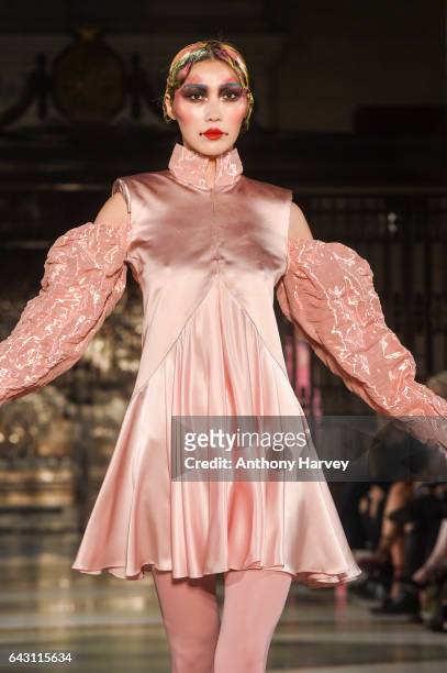 Model walks the runway at the David Ferreira show during the London Fashion Week February 2017 collections on February 20, 2017 in London, England.