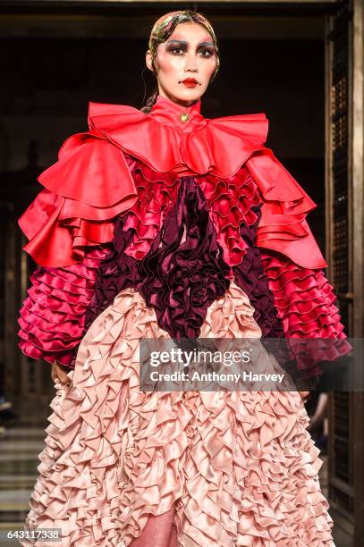 Model walks the runway at the David Ferreira show during the London Fashion Week February 2017 collections on February 20, 2017 in London, England.