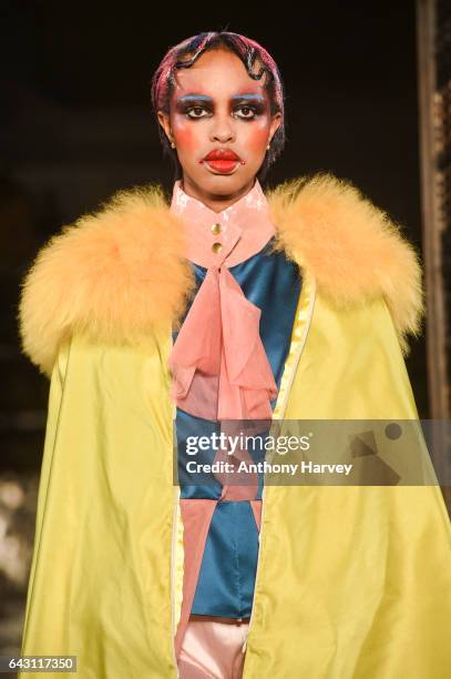 Model walks the runway at the David Ferreira show during the London Fashion Week February 2017 collections on February 20, 2017 in London, England.