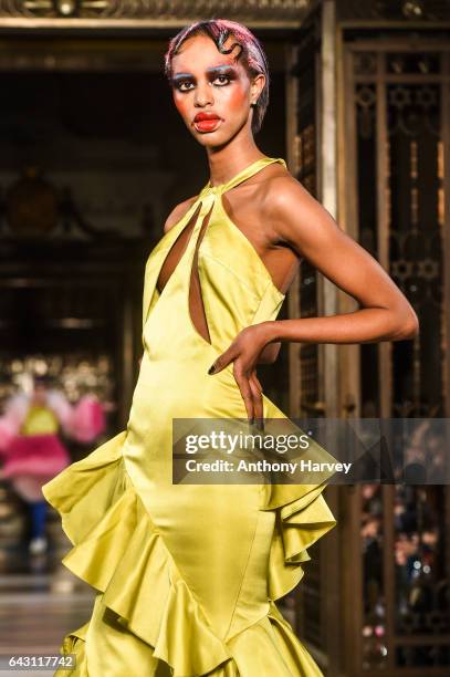 Model walks the runway at the David Ferreira show during the London Fashion Week February 2017 collections on February 20, 2017 in London, England.