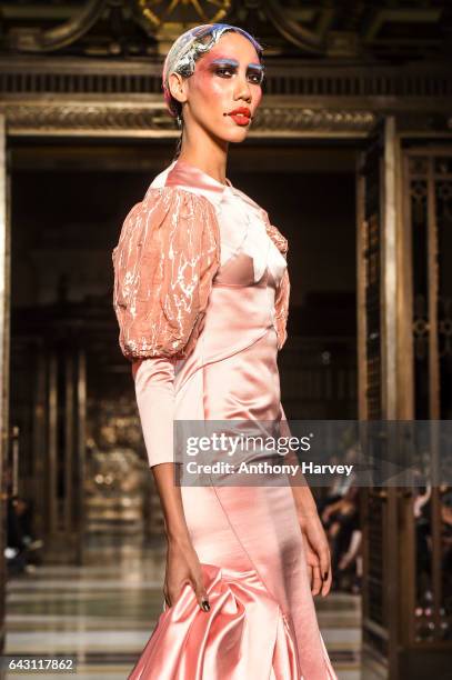 Model walks the runway at the David Ferreira show during the London Fashion Week February 2017 collections on February 20, 2017 in London, England.