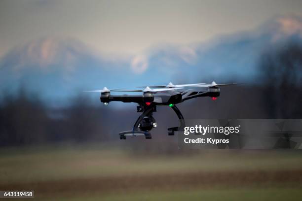 europe, germany, bavaria, view of drone flying (alps in background) - quadcopter stock pictures, royalty-free photos & images