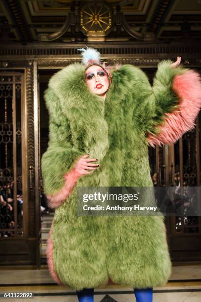 Model walks the runway at the David Ferreira show during the London Fashion Week February 2017 collections on February 20, 2017 in London, England.