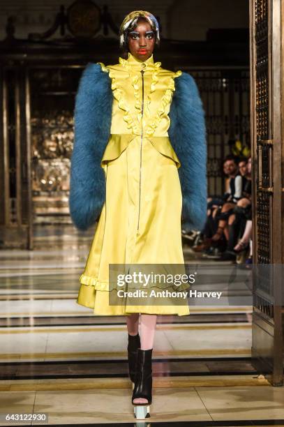 Model walks the runway at the David Ferreira show during the London Fashion Week February 2017 collections on February 20, 2017 in London, England.