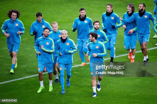 Karim Bellarabi , Kevin Kampl, Hakan Calhanoglu and the team of Leverkusen warm up during the training prior the UEFA Champions League Round of 16...