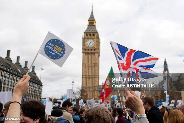 Flags are waved in front of the Elizabeth Tower, better known as "Big Ben", near the Houses of Parliament during a "Flag Mob" demonstration in...