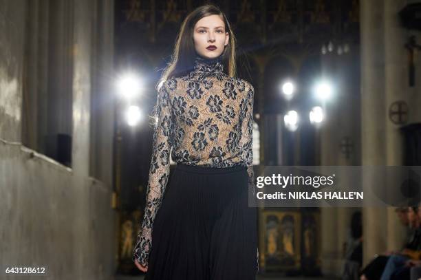 Model presents creations by Irish designer Sharon Wauchob during a catwalk show on the fourth day of the Autumn/Winter 2017 London Fashion Week in...