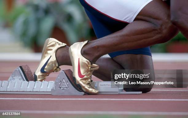 The gold track shoes of Michael Johnson of the USA enroute to winning the men's 200 metres final during the Summer Olympic Games in Atlanta, Georgia...