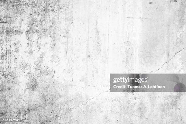 worn concrete wall texture background with paint partly faded, in black&white. - dirt ストックフォトと画像