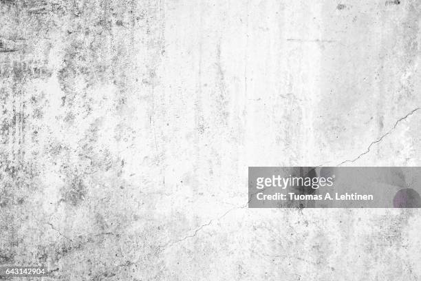 worn concrete wall texture background with paint partly faded, in black&white. - dirty stock pictures, royalty-free photos & images