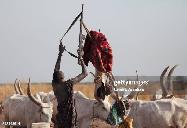 Mundari man is seen with his weapon in Terekeka town of Juba, South Sudan on February 9, 2017. Munda people, a small ethnic group of South Sudan,...