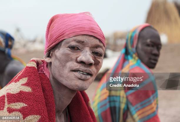 Mundari man, covered his face and body with ash to protect himself from insects and mosquitos, is seen in Terekeka town of Juba, South Sudan on...