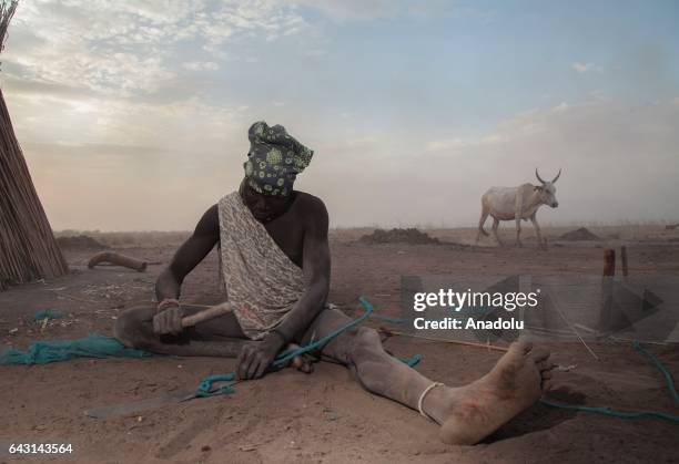 Mundari man is seen in Terekeka town of Juba, South Sudan on February 9, 2017. Munda people, a small ethnic group of South Sudan, provide their lives...