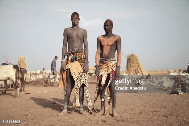 Mundari men are seen with their traditional costumes in Terekeka town of Juba, South Sudan on February 9, 2017. Munda people, a small ethnic group of...