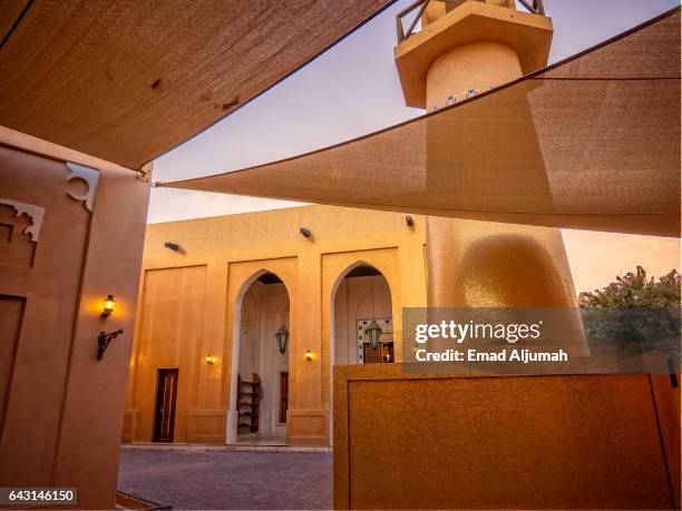 the golden mosque at katara cultural village, doha, qatar - qatar mosque stock pictures, royalty-free photos & images