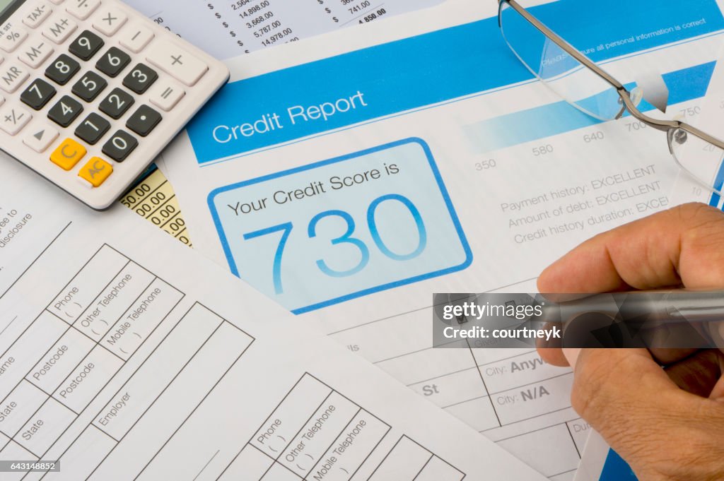 Credit report form on a desk with other paperwork.