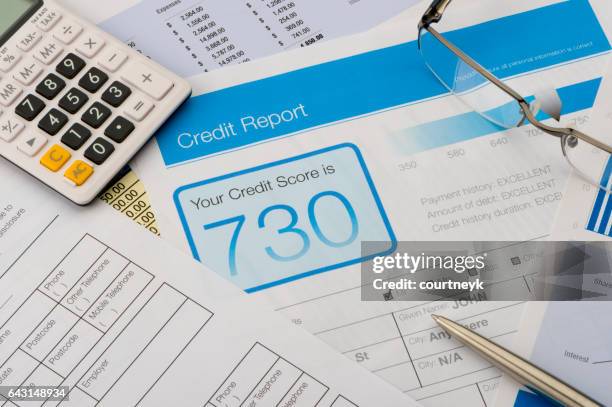 credit report form on a desk with other paperwork. - cartão de resultados imagens e fotografias de stock