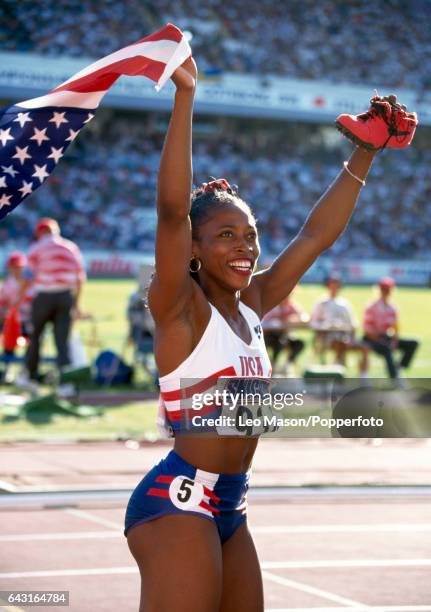 Gail Devers of the USA celebrates winning the women's 100 metres hurdles during the World Athletics Championships in Gothenburg, Sweden, circa August...