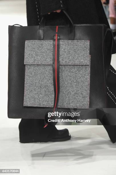 Model, bag detail, walks the runway at the Irynvigre show during the London Fashion Week February 2017 collections on February 20, 2017 in London,...