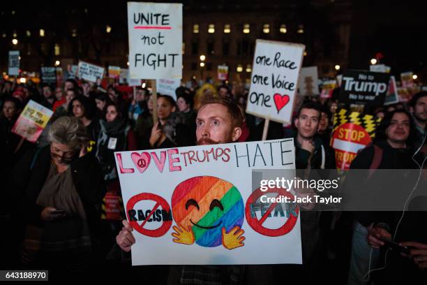 Protester holds up a placard during a rally in Parliament Square against US president Donald Trump's state visit to the UK on February 20, 2017 in...