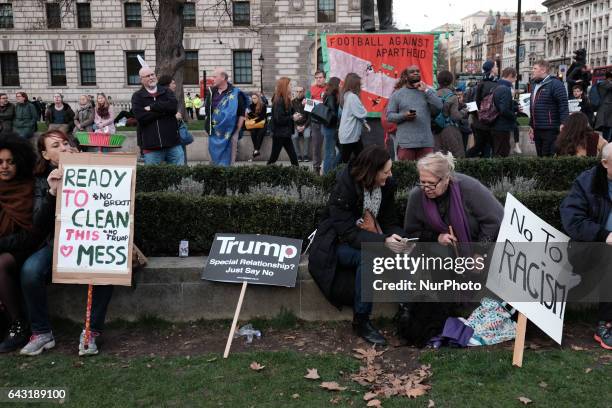 Thousands of protesters holding placards take part in a rally in Parliament Square against US president Donald Trump's state visit to the UK on...