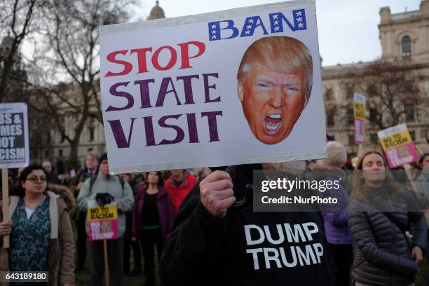 Thousands of protesters holding placards take part in a rally in Parliament Square against US president Donald Trump's state visit to the UK on...