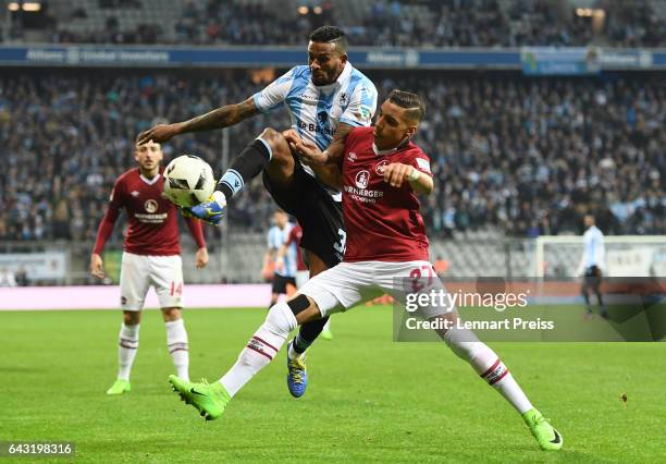 Amilton of TSV 1860 Muenchen challenges Abdelhamid Sabiri of 1. FC Nuernberg during the Second Bundesliga match between TSV 1860 Muenchen and 1. FC...