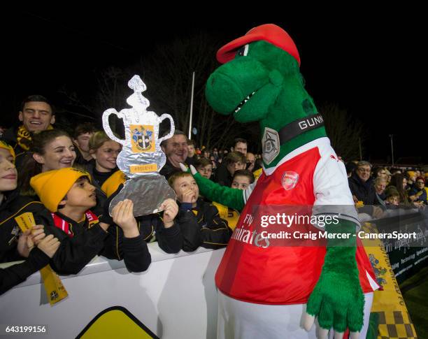 Sutton United fans meet the Arsenal mascot before the Emirates FA Cup Fifth Round match between Sutton United and Arsenal at Gander Green Lane on...