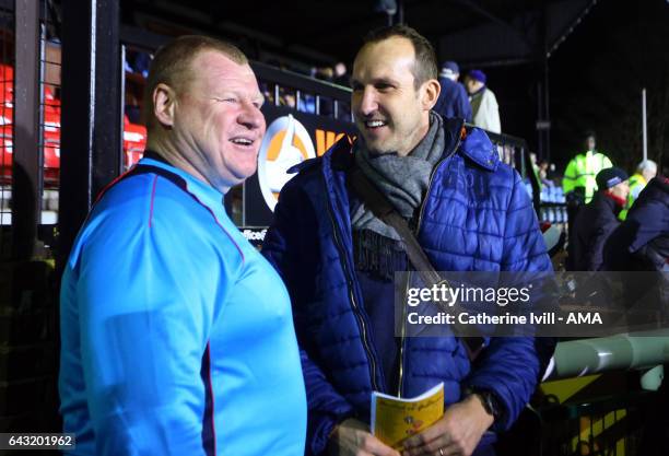 Wayne Shaw of Sutton United talks to goalkeeper Mark Schwarzer before The Emirates FA Cup Fifth Round match between Sutton United and Arsenal on...