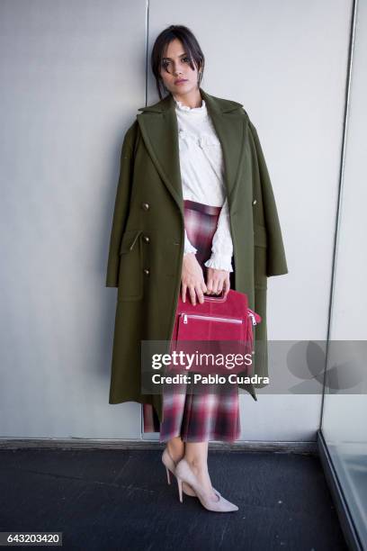 Actress Michelle Calvo wears Ursula Mascaro shoes, Angel Schlesser trousers, shirt and jacket and Maje handbag at Ifema during Mercedes Benz Fashion...