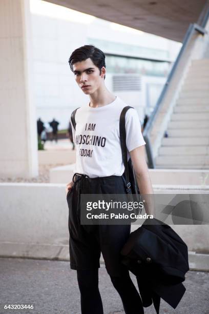 Model Rodrigo Laguna wears Zara trousers, Moschino t-shirt, Zara Jacket and H&M handbag at Ifema during Mercedes Benz Fashion Week Madrid Autumn /...