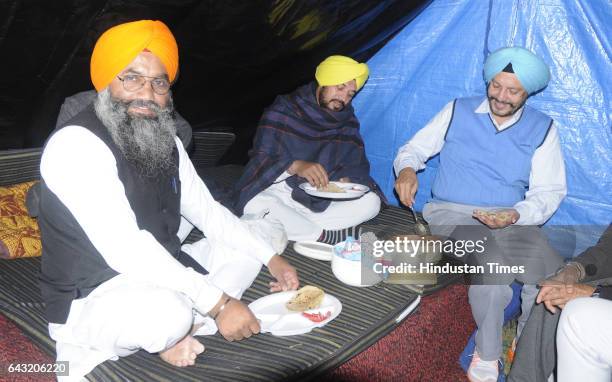 Candidates Jagtar Singh Rajla , Gurdev Singh Mann and Dr. Balbir Singh having dinner at their makeshift home outside the sealed 'strong room' where...