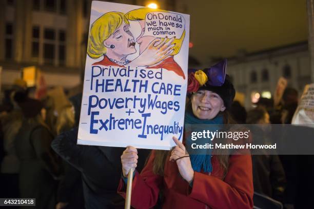 Protestor holds a sign during a protest on Queen Street against plans for a state visit to the UK by US President Donald Trump on February 20, 2017...