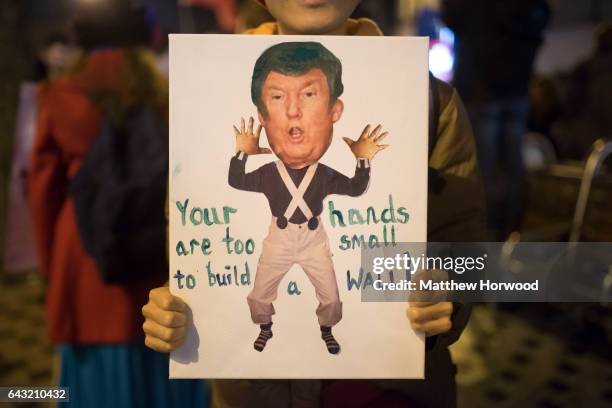 Protestor holds a sign during a protest on Queen Street against plans for a state visit to the UK by President Donald Trump on February 20, 2017 in...