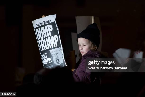 Girl holds a sign during a protest on Queen Street against plans for a state visit to the UK by President Donald Trump on February 20, 2017 in...