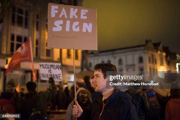 Protestor holds a sign during a protest on Queen Street against plans for a state visit to the UK by President Donald Trump on February 20, 2017 in...
