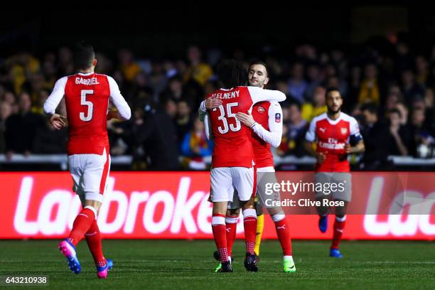 Lucas of Arsenal celebrates with team-mates after scporing the opening goal during the Emirates FA Cup fifth round match between Sutton United and...