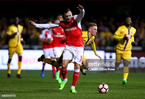 Lucas of Arsenal battles for the ball with Adam May of Sutton United during the Emirates FA Cup fifth round match between Sutton United and Arsenal...