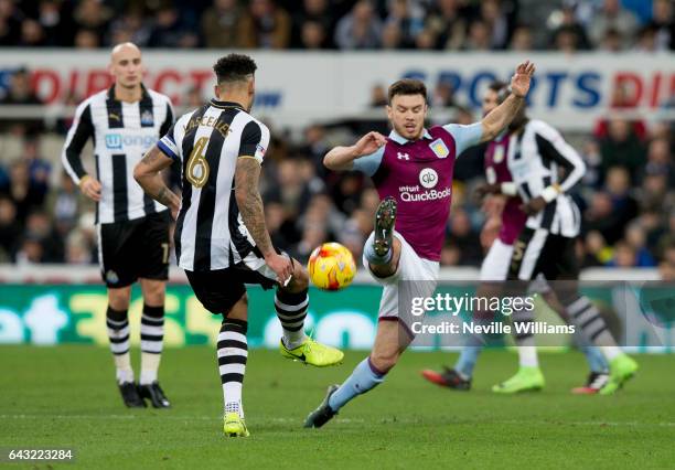 Scott Hogan of Aston Villa is challenged by Jamaal Lascelles of Newcastle United during the Sky Bet Championship match between Newcastle United and...