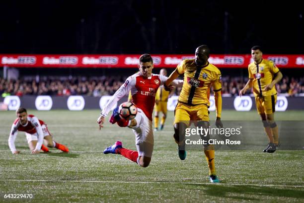 Gabriel Paulista of Arsenal clears the ball under pressure from Bedsente Gomis of Sutton United during the Emirates FA Cup fifth round match between...