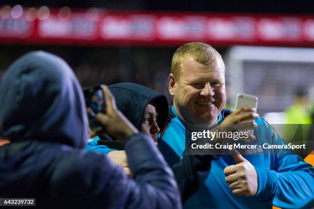 Sutton United reserve goalkeeper Wayne Shaw poses for a selfie with fans after the Emirates FA Cup Fifth Round match between Sutton United and...