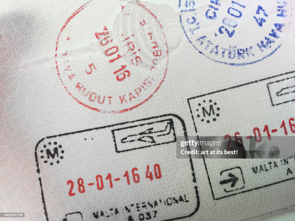 Immigration stamps on a passport