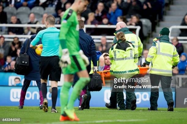 Scott Hogan of Aston Villa is stretchered off the pitch during the Sky Bet Championship match between Newcastle United and Aston Villa at St James'...