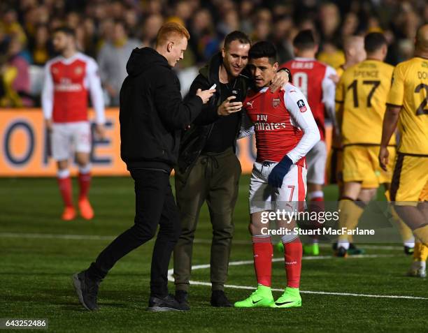 Arsenal's Alexis Sanchez has a selfie taken with fans after the Emirates FA Cup Fifth Round match between Sutton United and Arsenal on February 20,...