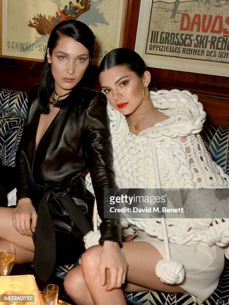 Bella Hadid and Kendall Jenner, wearing Burberry Feb 2017 Couture cape at the LOVE and Burberry London Fashion Week Party at Annabel's celebrating...